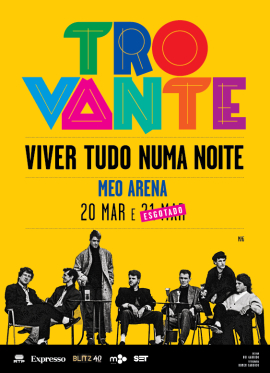 Imagem de cartaz do concerto "Trovante - Viver Tudo Numa Noite" com os membros da banda em pose em fundo amarelo.